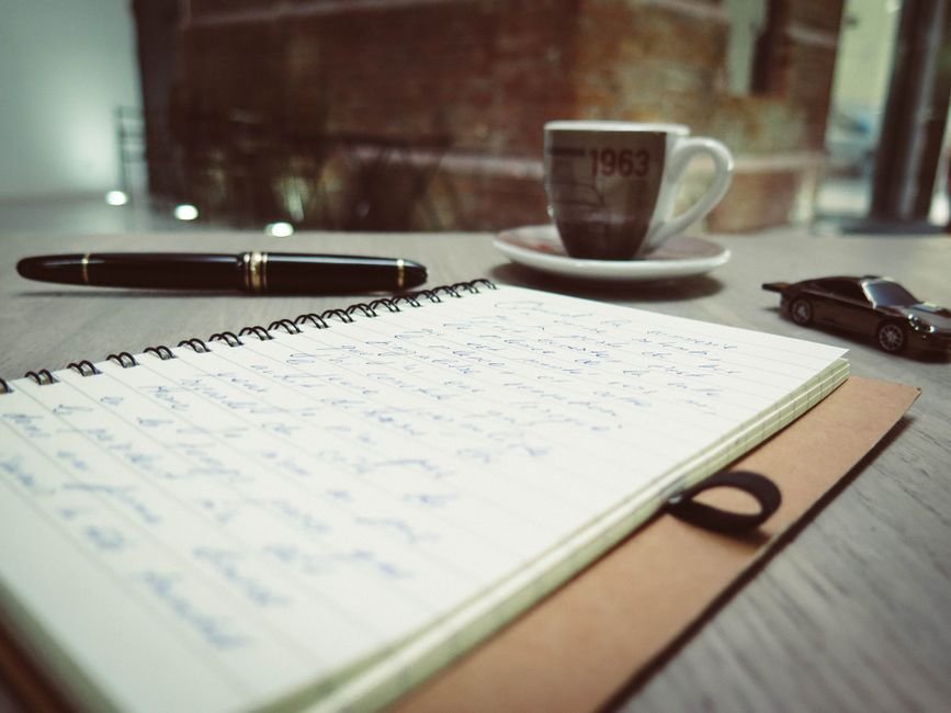 Writing on a worksheet at a table