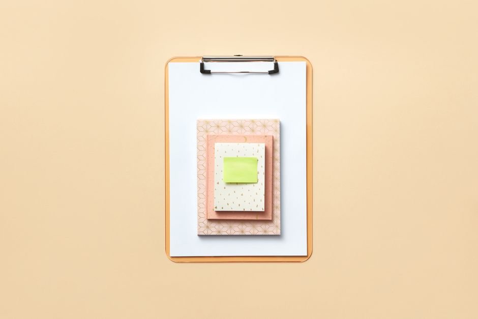 Clipboard and notes on a desk